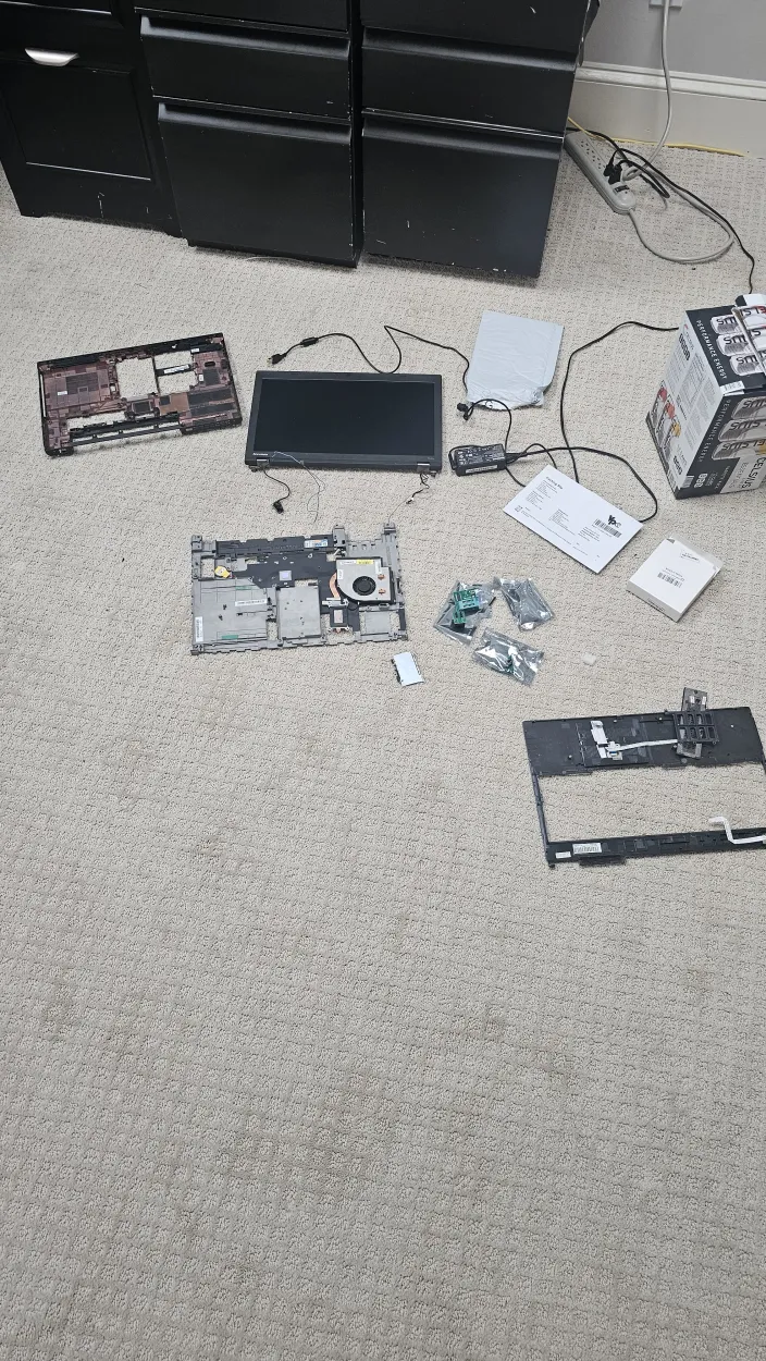 Reflashing the ThinkPad T540p system board over an SPI programmer clip to remove the Lenovo WWAN whitelist.